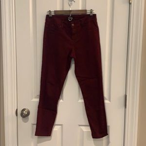 Burgundy size 4 skinny stretch jeans.